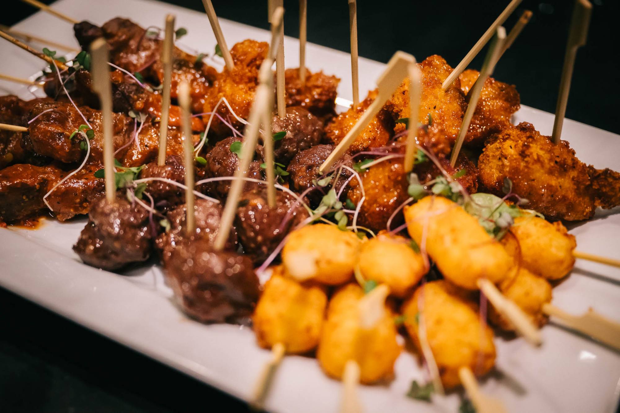 assortment of passed appetizers cocktail party display