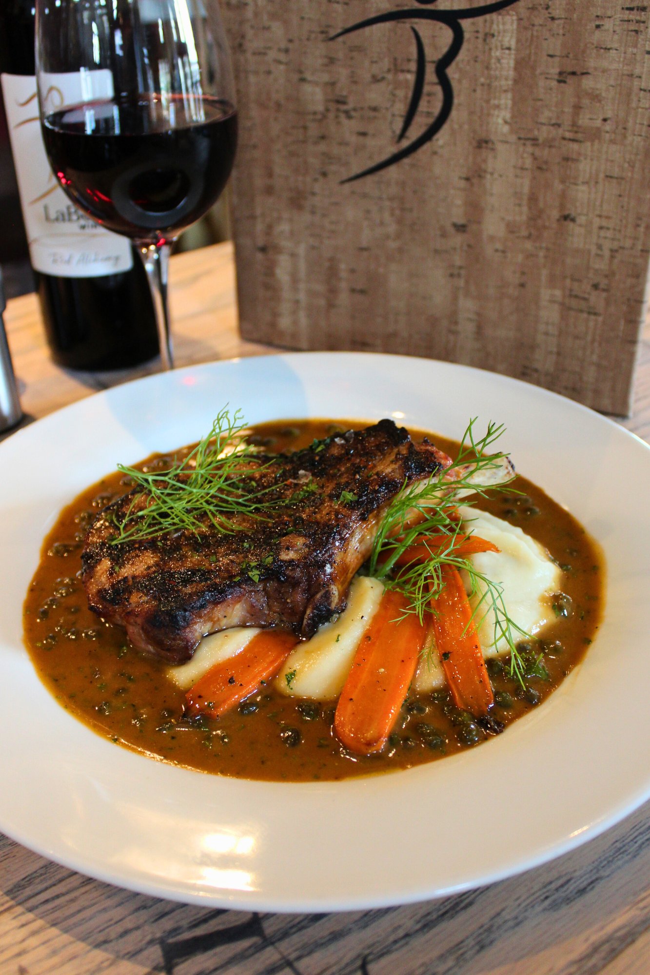 grilled pork chop spring 2025 menu at the bistro